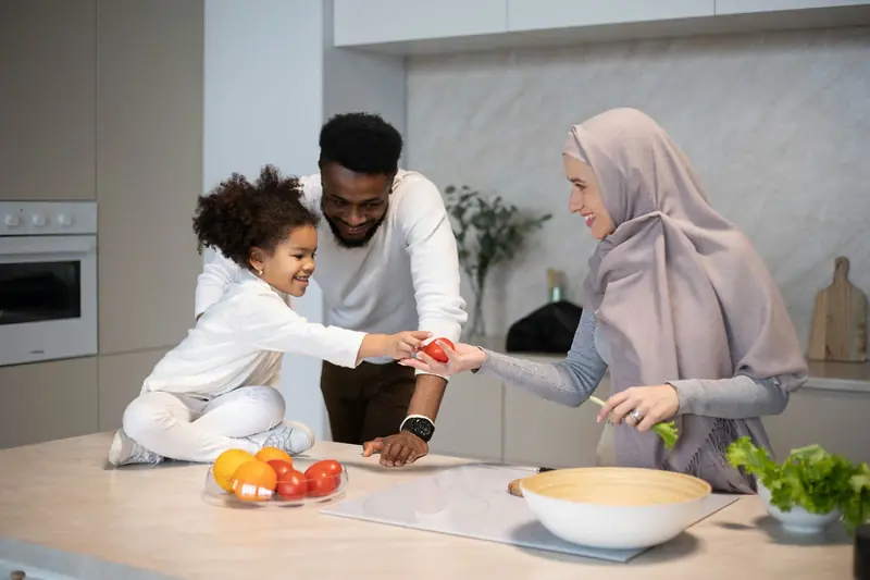 Family preparing fresh food together in the kitchen